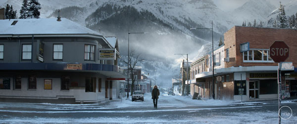 Snow covered village with mountain